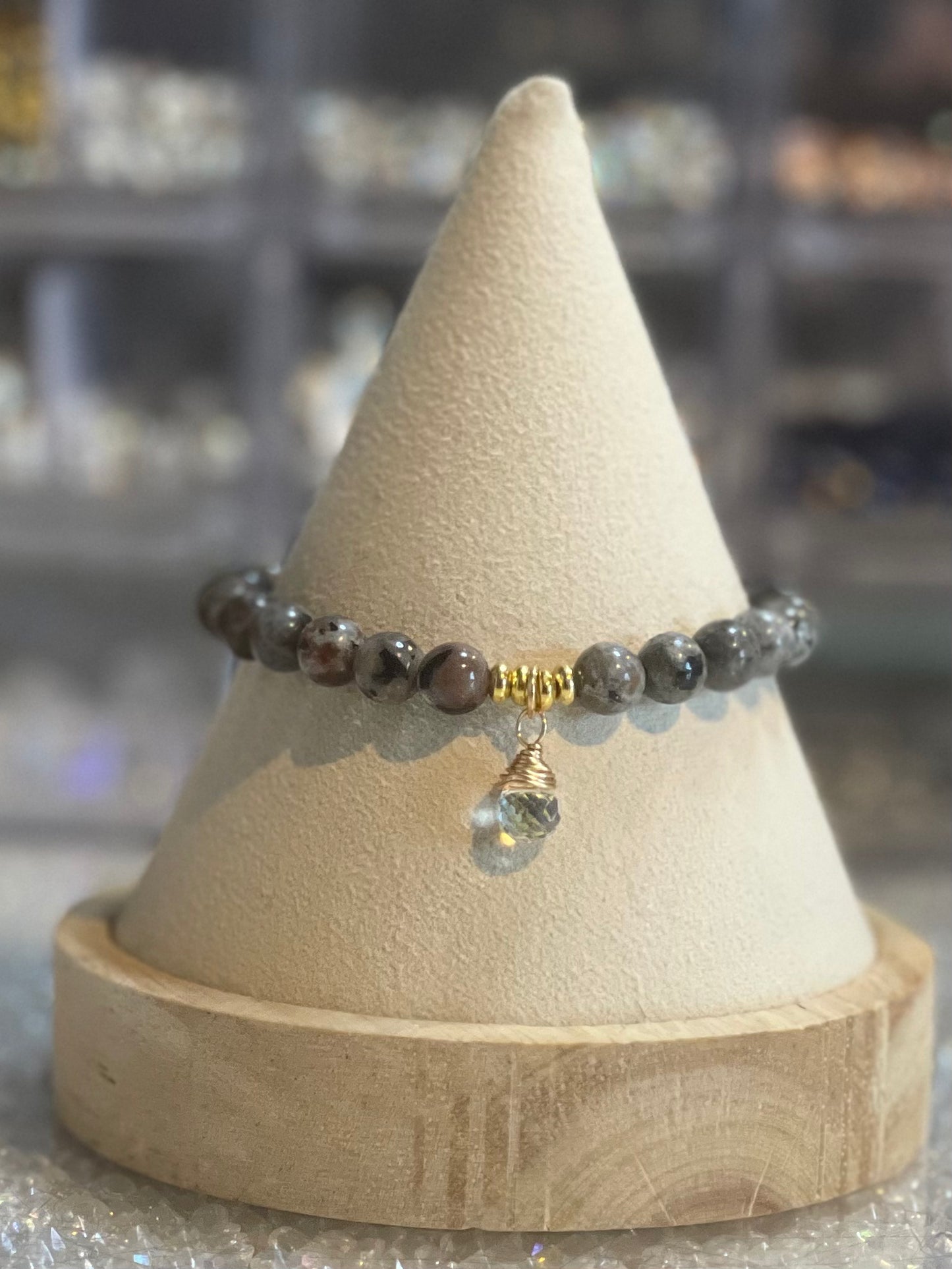 Yooperite illuminating 6mm stone bracelet with gold accents and charm